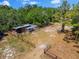 Aerial view of chicken coop on a treed lot at 22520 61St E Ave, Bradenton, FL 34211