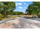 The property features a lot with lots of mature trees and an abundance of space to build at 22520 61St E Ave, Bradenton, FL 34211