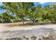 Serene property featuring mature trees, possible construction site, and natural beauty at 22520 61St E Ave, Bradenton, FL 34211