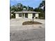 Charming single-story home with a spacious driveway and tropical landscaping at 2510 N Osprey Ave, Sarasota, FL 34234