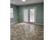 Bright living room featuring tile floors and french doors leading to an outdoor space at 2510 N Osprey Ave, Sarasota, FL 34234