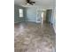 Spacious living room featuring tile floors, ceiling fan, and a pair of french doors at 2510 N Osprey Ave, Sarasota, FL 34234