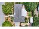 An aerial view of a home featuring a well-maintained roof and lush green landscaping that surrounds the property at 2610 Jefferson Cir, Sarasota, FL 34239