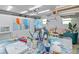 Functional art studio with art tables, chairs, and a variety of art supplies, ideal for creative projects at 2610 Jefferson Cir, Sarasota, FL 34239