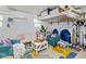 Relaxing art studio with mini-split AC, seating area with white sofa and table, and art supplies storage at 2610 Jefferson Cir, Sarasota, FL 34239