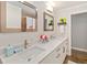Bathroom boasts dual sinks, quartz countertops and brushed nickel faucets at 2610 Jefferson Cir, Sarasota, FL 34239