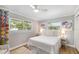 Bright bedroom with natural light, wood-look floors, and closet at 2610 Jefferson Cir, Sarasota, FL 34239