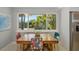 Well-lit dining area with outdoor view and colorful seating at 2610 Jefferson Cir, Sarasota, FL 34239
