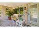 Cozy front porch area with comfortable seating and a view of the neighborhood at 2610 Jefferson Cir, Sarasota, FL 34239