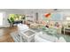 Inviting living room featuring ample natural light, stylish decor, and hardwood flooring at 2610 Jefferson Cir, Sarasota, FL 34239