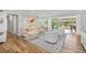 Bright and airy living room with hardwood floors and sliding doors to the outdoors at 2610 Jefferson Cir, Sarasota, FL 34239