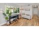 Cozy living room featuring hardwood floors, large window, and ample natural light at 2610 Jefferson Cir, Sarasota, FL 34239