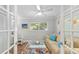 Well-lit office featuring french doors, hardwood floors and neutral decor at 2610 Jefferson Cir, Sarasota, FL 34239