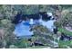 Scenic pond view featuring a fountain, bridge, and walking path for relaxing strolls at 2610 Jefferson Cir, Sarasota, FL 34239