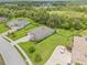 Aerial view of a home featuring lush greenery, well-manicured lawns, and a private backyard at 2707 162Nd E Ave, Parrish, FL 34219