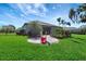 Spacious backyard with lush lawn, patio and slide at 2707 162Nd E Ave, Parrish, FL 34219
