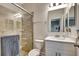 Modern bathroom featuring glass-enclosed shower with tile surround and a vanity with ample storage at 2707 162Nd E Ave, Parrish, FL 34219