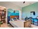 Stylish bedroom with custom wall mural, and nearby walk-in closet at 2707 162Nd E Ave, Parrish, FL 34219