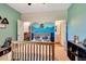 Spacious bedroom featuring an ensuite bath, closet, and a vibrant mountain-themed mural at 2707 162Nd E Ave, Parrish, FL 34219