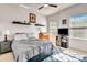 Inviting bedroom with neutral tones, plush bedding, and decor shelves for personalized display at 2707 162Nd E Ave, Parrish, FL 34219