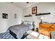 Bedroom with gray comforter, hardwood dresser and gray patterned rug at 2707 162Nd E Ave, Parrish, FL 34219