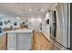 Bright, modern kitchen with a large island, white cabinets, and stainless steel appliances at 2707 162Nd E Ave, Parrish, FL 34219