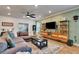 Inviting living room featuring a comfortable sectional sofa, entertainment center, and neutral decor at 2707 162Nd E Ave, Parrish, FL 34219