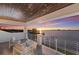 An open balcony with sunset water views and stylish outdoor seating at 327 Riverpoint Ne Dr, Bradenton, FL 34208