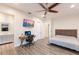 Spacious bedroom with a desk and a lovely bathroom, featuring modern design and natural light at 327 Riverpoint Ne Dr, Bradenton, FL 34208