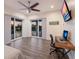 Open bedroom with a view to the balcony and a sliding glass doors at 327 Riverpoint Ne Dr, Bradenton, FL 34208