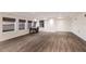 Large bonus room with views from multiple windows and featuring wood flooring at 327 Riverpoint Ne Dr, Bradenton, FL 34208