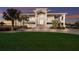 Elegant waterfront property with manicured lawn, multi-level balconies, and ample parking space at 327 Riverpoint Ne Dr, Bradenton, FL 34208