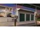 Garage with three bays, green garage doors, and composite decking at 327 Riverpoint Ne Dr, Bradenton, FL 34208