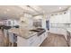 Spacious, bright kitchen with large island, eat in seating, and stainless steel appliances at 327 Riverpoint Ne Dr, Bradenton, FL 34208