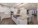 Elegant kitchen with large island featuring granite countertops, stainless appliances, and ample storage at 327 Riverpoint Ne Dr, Bradenton, FL 34208