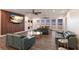 A spacious living room with hardwood floors, water view, and modern furnishings at 327 Riverpoint Ne Dr, Bradenton, FL 34208
