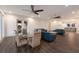 Open-concept living area with water view, modern furniture, and hardwood floors at 327 Riverpoint Ne Dr, Bradenton, FL 34208