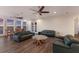 Open-concept living room with water views, hardwood floors, and comfortable seating at 327 Riverpoint Ne Dr, Bradenton, FL 34208