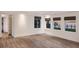Bright living room features hardwood floors, large windows showcasing waterfront views, and recessed lighting at 327 Riverpoint Ne Dr, Bradenton, FL 34208