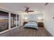 Comfortable main bedroom with private balcony, ceiling fan, and beautiful view at 327 Riverpoint Ne Dr, Bradenton, FL 34208