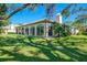 Beautiful home exterior featuring large windows and lush landscaping at 3320 Hadfield Greene # 39, Sarasota, FL 34235