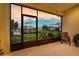 Relaxing outdoor patio offering picturesque views of the lake and surrounding greenery at 3520 Woodmont Dr, Parrish, FL 34219