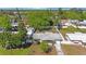 Aerial view of home with a fully fenced backyard, mature trees, and a well-maintained landscape, showcasing its curb appeal at 3828 20Th N St, St Petersburg, FL 33714