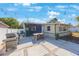 This backyard features a grill, a dining table, and patio made of stone at 3828 20Th N St, St Petersburg, FL 33714