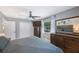 This cozy bedroom has a ceiling fan, a closet, and a dresser with a tv on top at 3828 20Th N St, St Petersburg, FL 33714