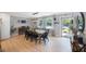 Bright dining area with hardwood floors, modern lighting, and large windows at 3828 20Th N St, St Petersburg, FL 33714