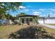 Charming single-story home featuring a well-manicured lawn and attached garage at 3828 20Th N St, St Petersburg, FL 33714