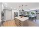 Open kitchen concept with island, stainless steel appliances and eating area at 3828 20Th N St, St Petersburg, FL 33714
