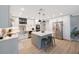 Bright kitchen boasts white cabinets, stainless steel appliances, and an island with bar seating at 3828 20Th N St, St Petersburg, FL 33714
