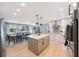 Well-lit modern kitchen with a center island and dining area with backyard views at 3828 20Th N St, St Petersburg, FL 33714